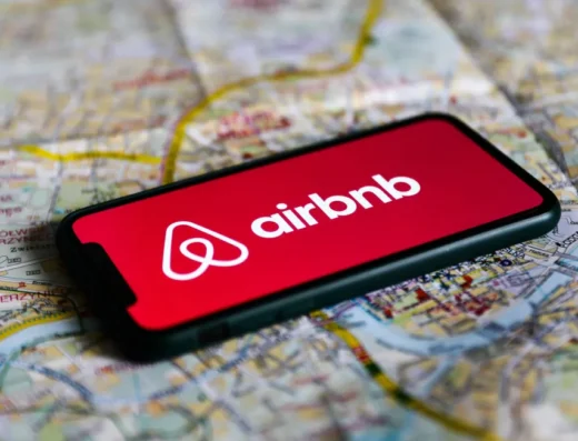 Airbnb logo displayed on a mobile phone