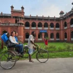 Foreigner traveling on Rickshaw in Dhaka Bangladesh