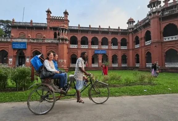 Foreigner traveling on Rickshaw in Dhaka Bangladesh